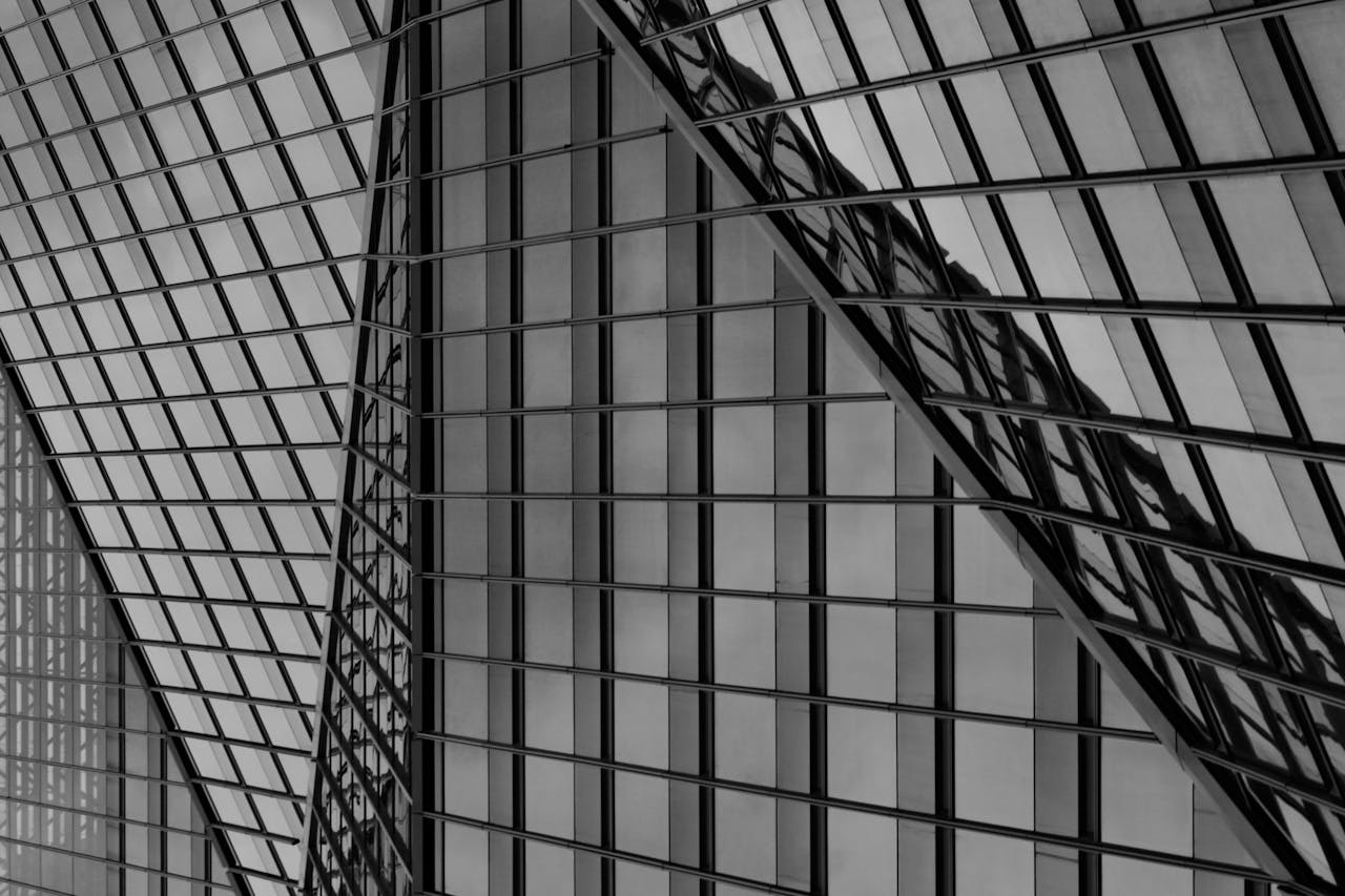 Abstract view of modern architectural glass facade in black and white.